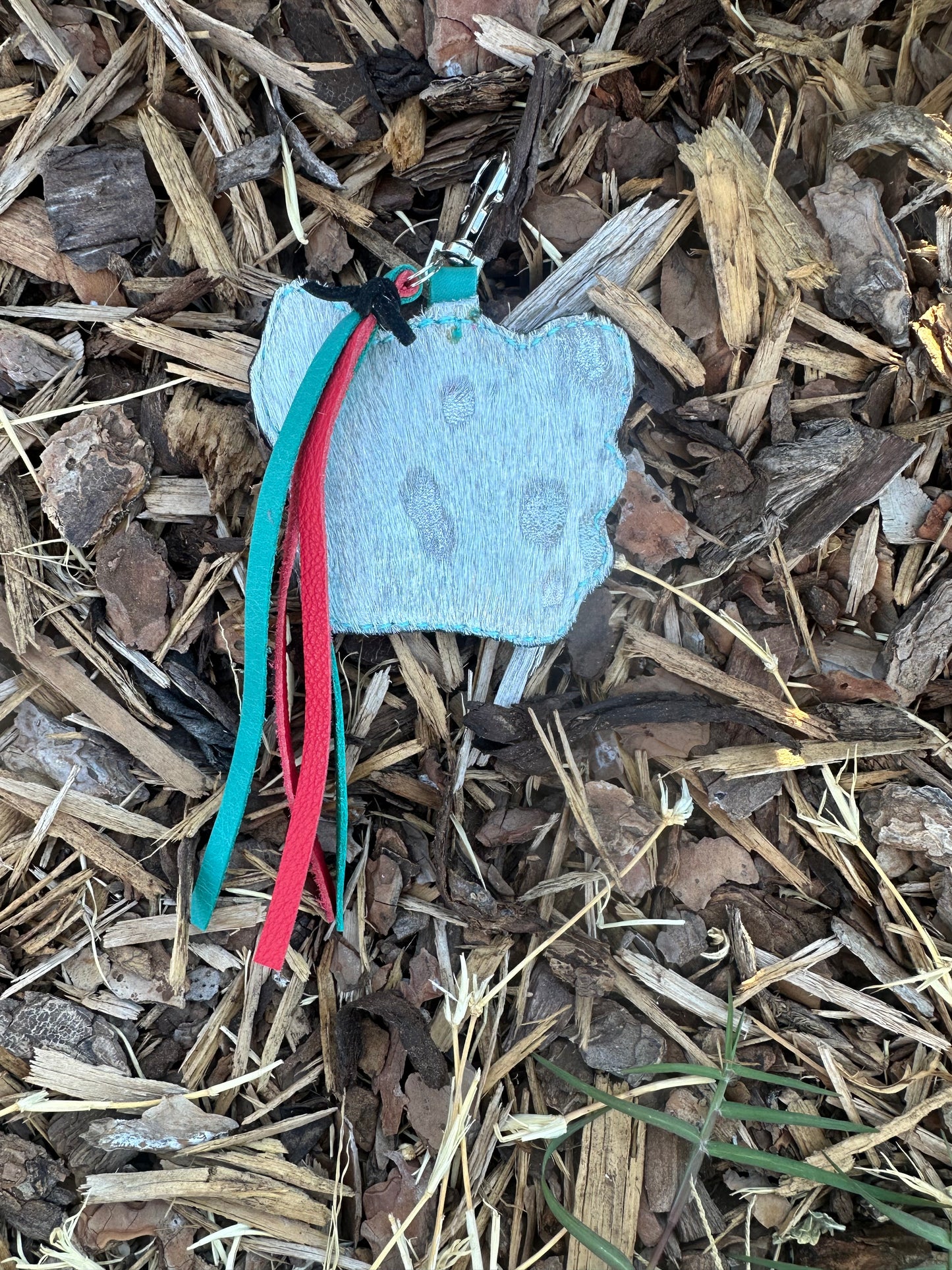 Western tooled leather feathered cow and turquoise keychain
