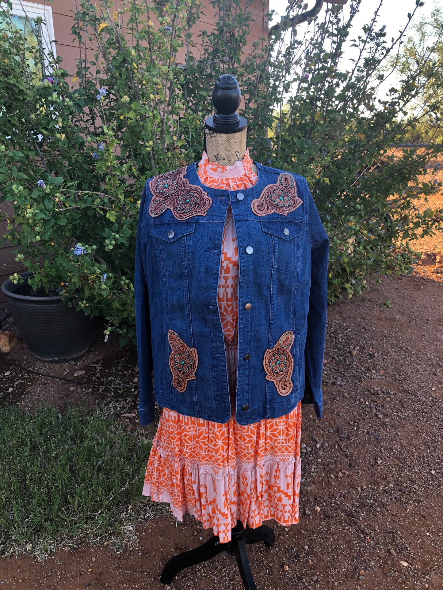 Women’s western tooled leather floral collarless denim jacket