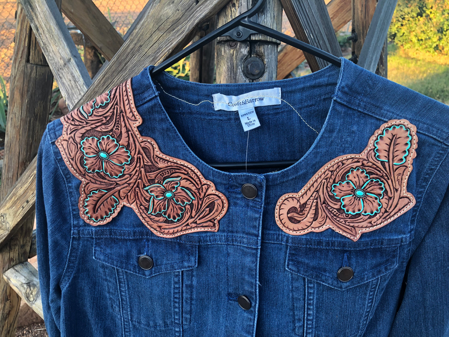 Women’s western tooled leather floral collarless denim jacket