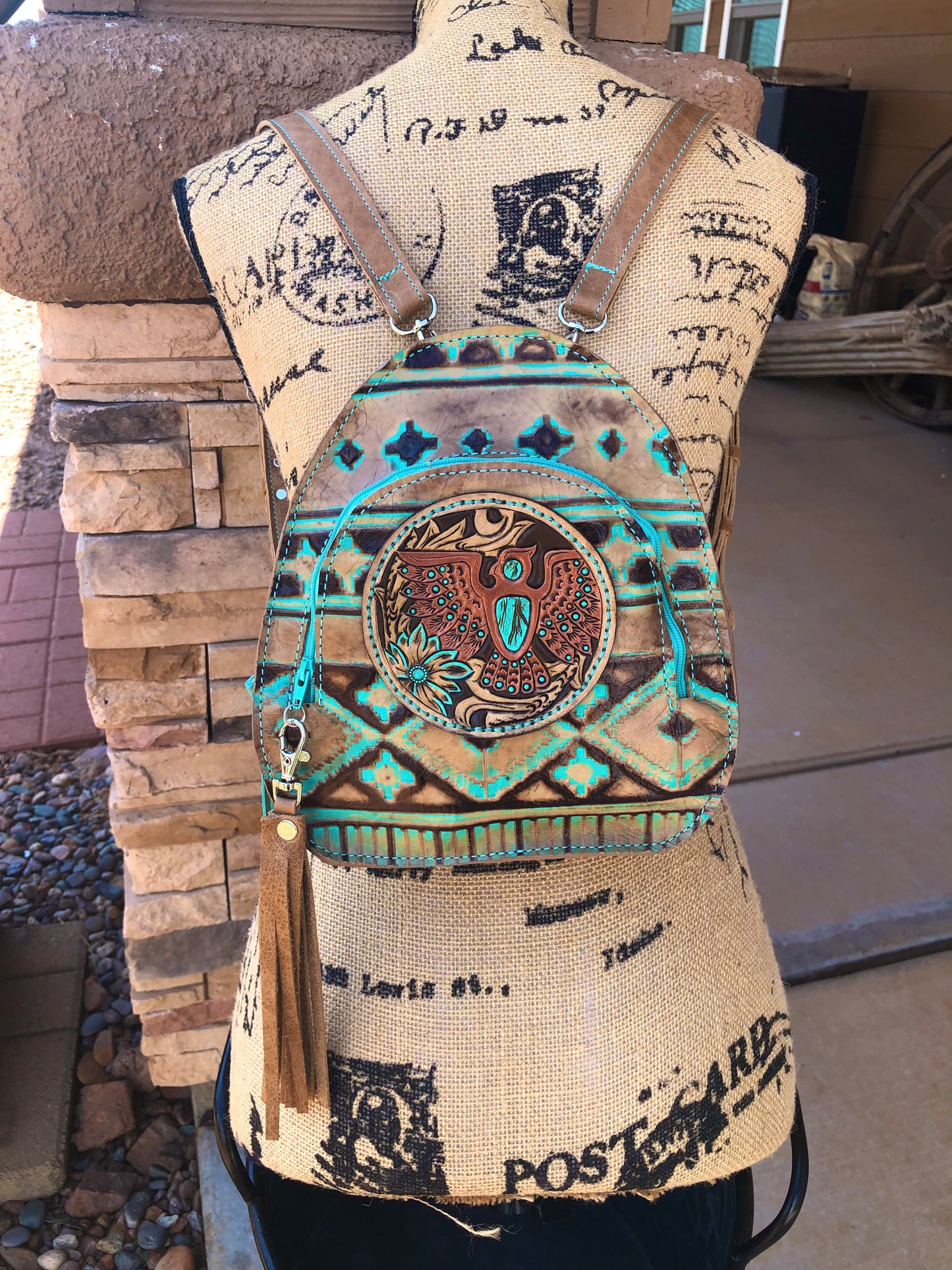 Southwestern tooled leather thunderbird patch backpack purse.