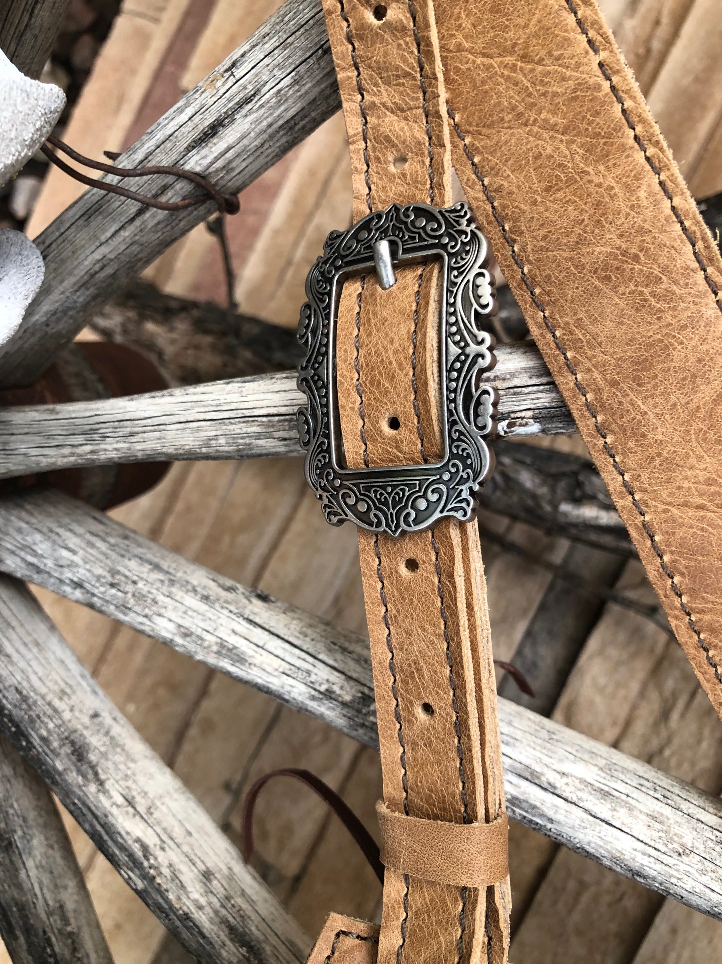 Small Southwestern tooled leather floral fringe sling bag
