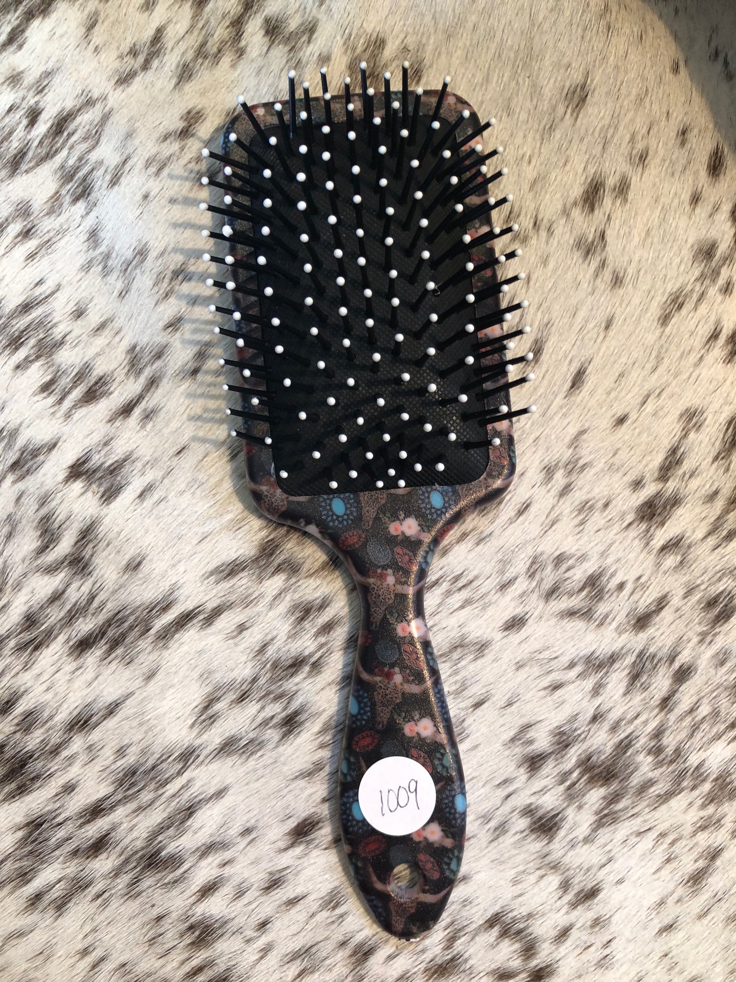 Western tooled leather turquoise jewelry patch on black leopard print cow skull and floral print paddle brush