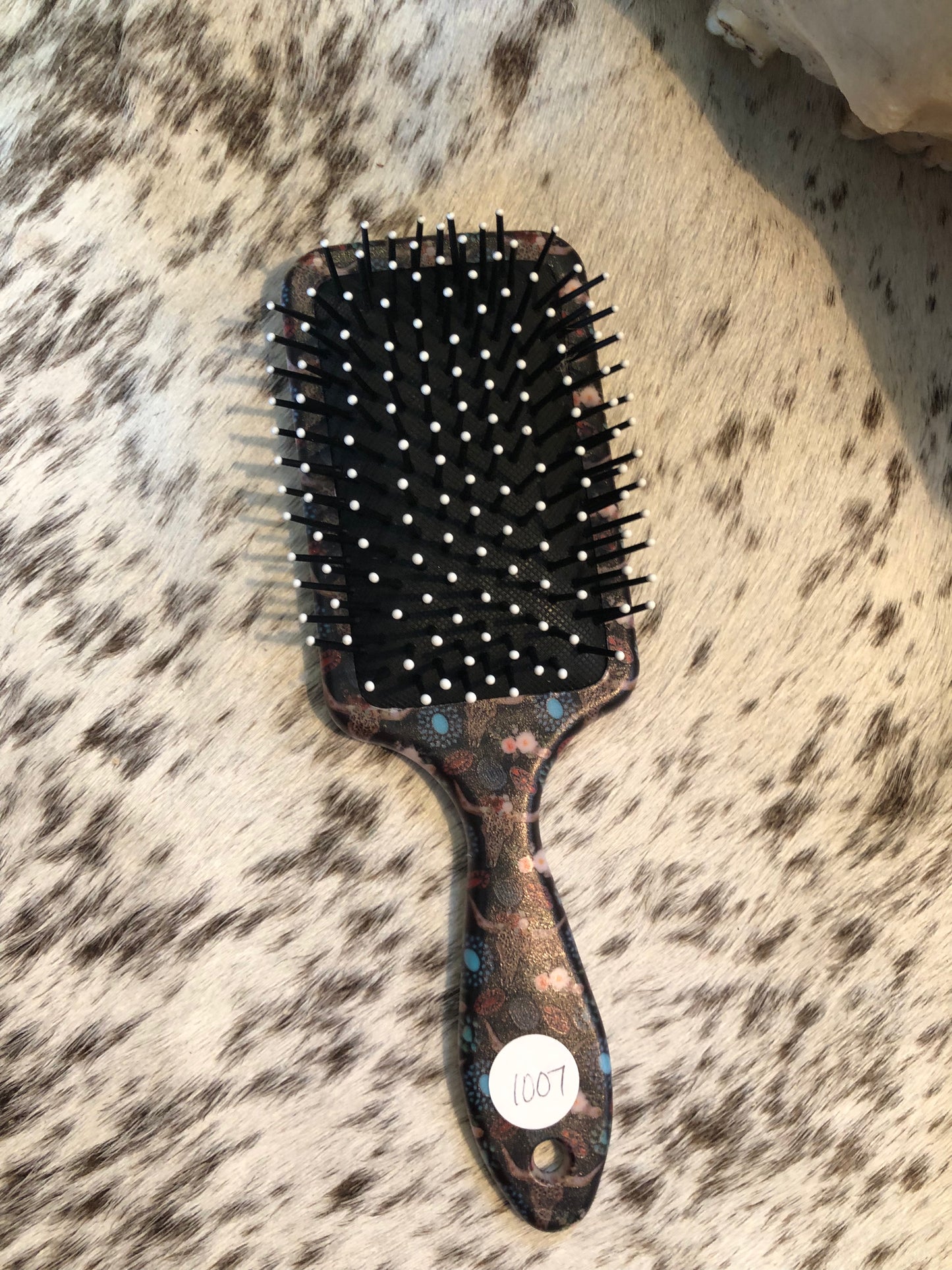 Western tooled leather turquoise jewelry patch on black leopard print cow skull and floral print paddle brush