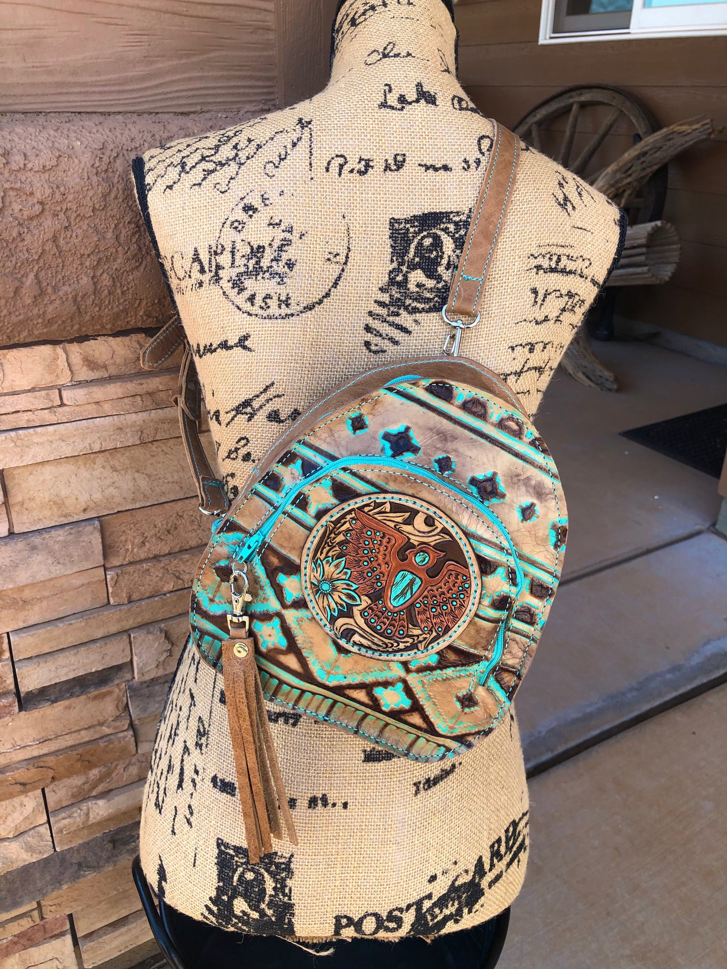 Southwestern tooled leather thunderbird patch backpack purse.