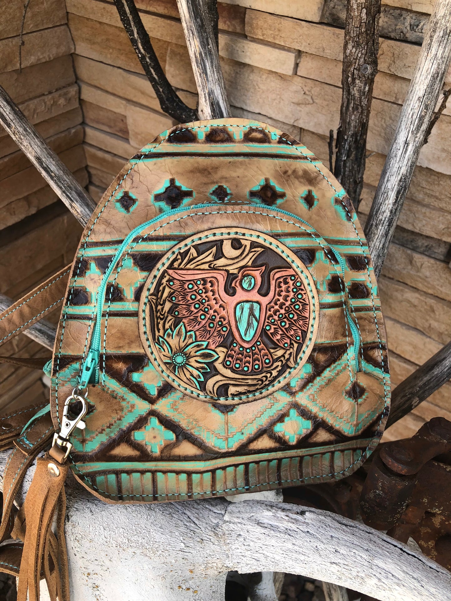 Southwestern tooled leather thunderbird patch backpack purse.