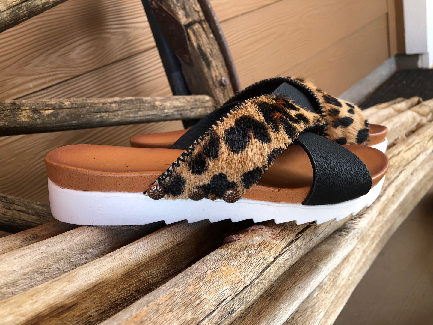 Women’s size 7 black and leopard print hair on hide sandals