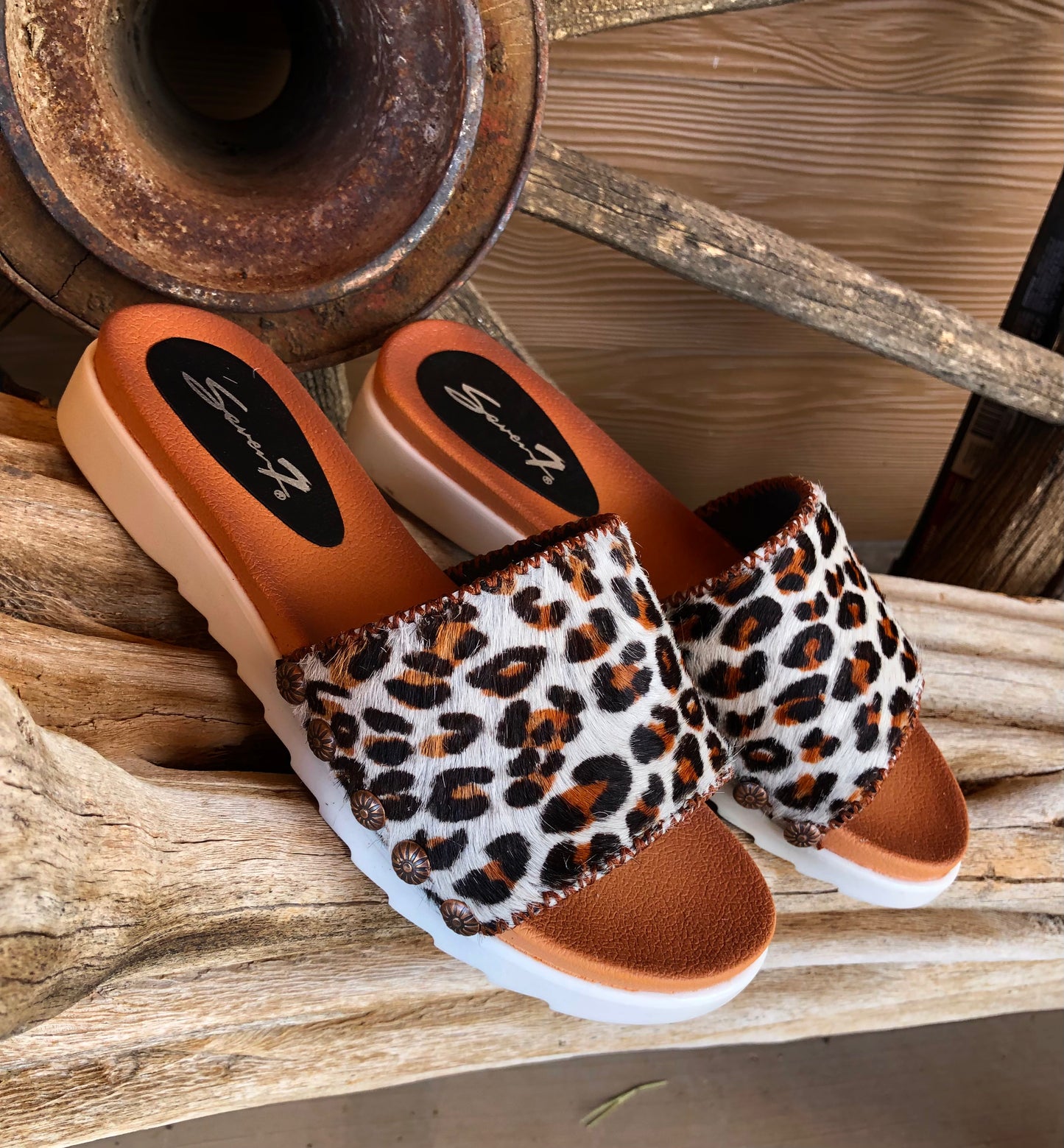 Women’s size 8 leopard print hair on hide slides
