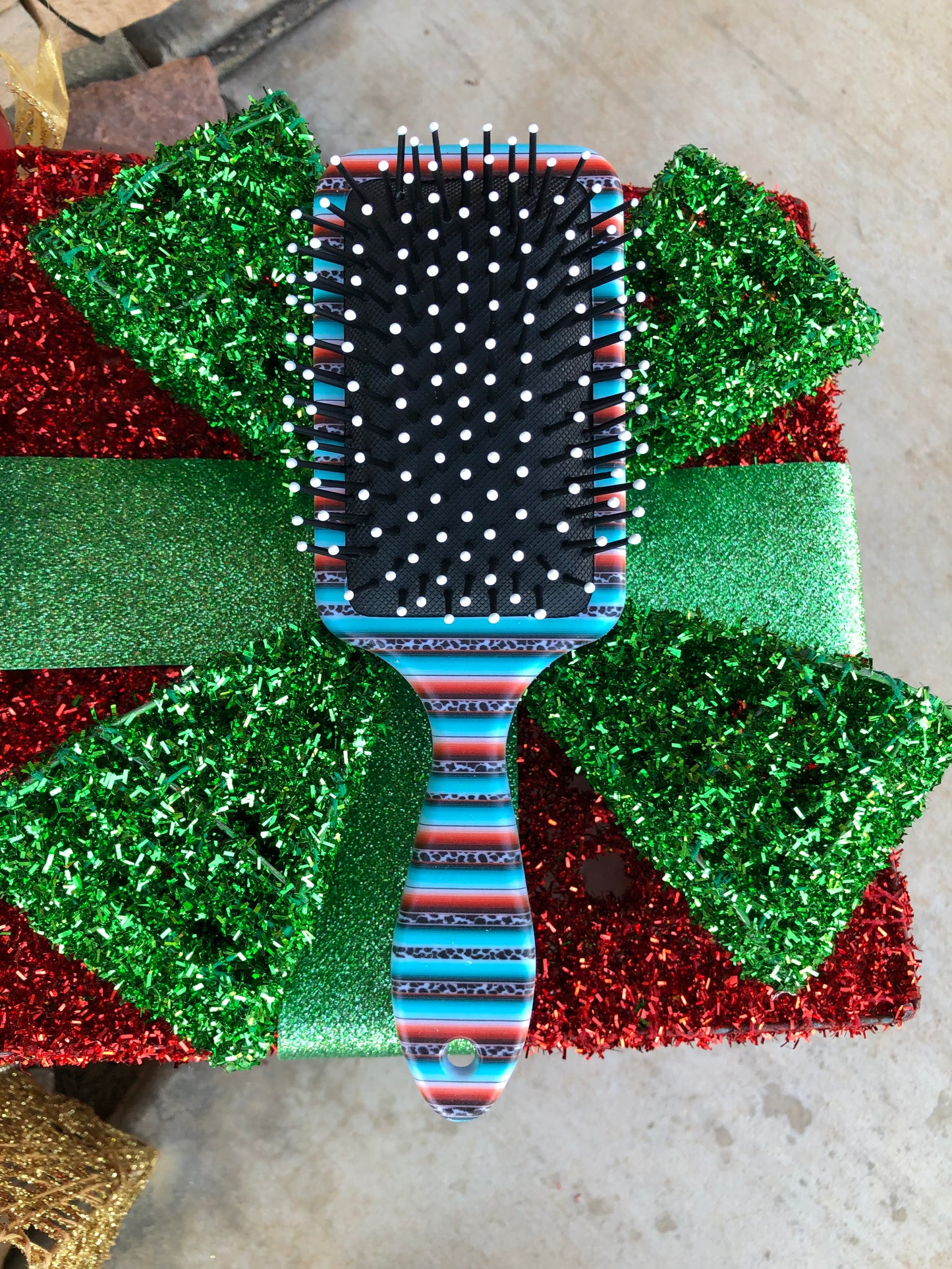 Western tooled leather sunflower and leopard print patch on serape and leopard print paddle brush