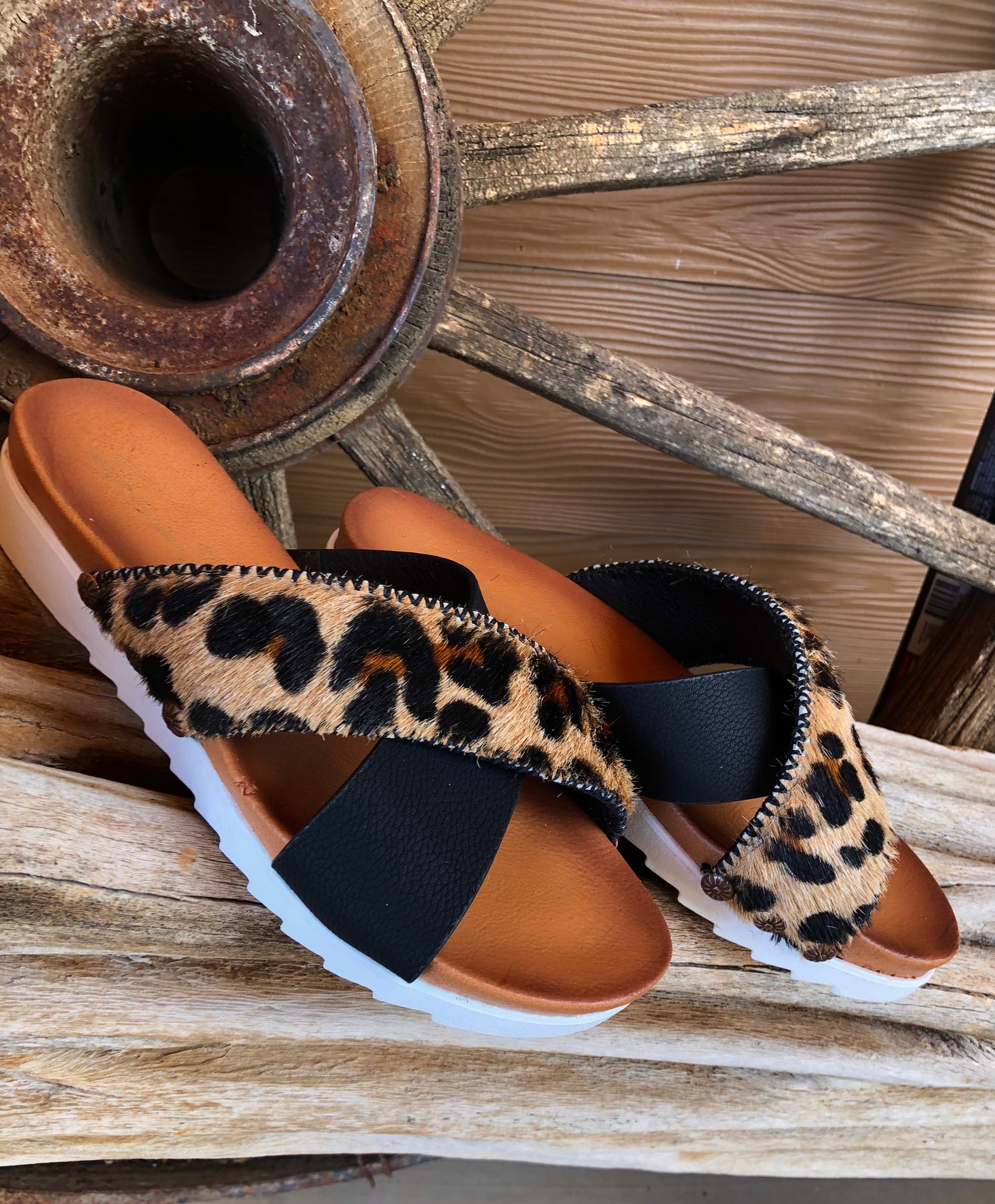 Women’s size 7 black and leopard print hair on hide sandals
