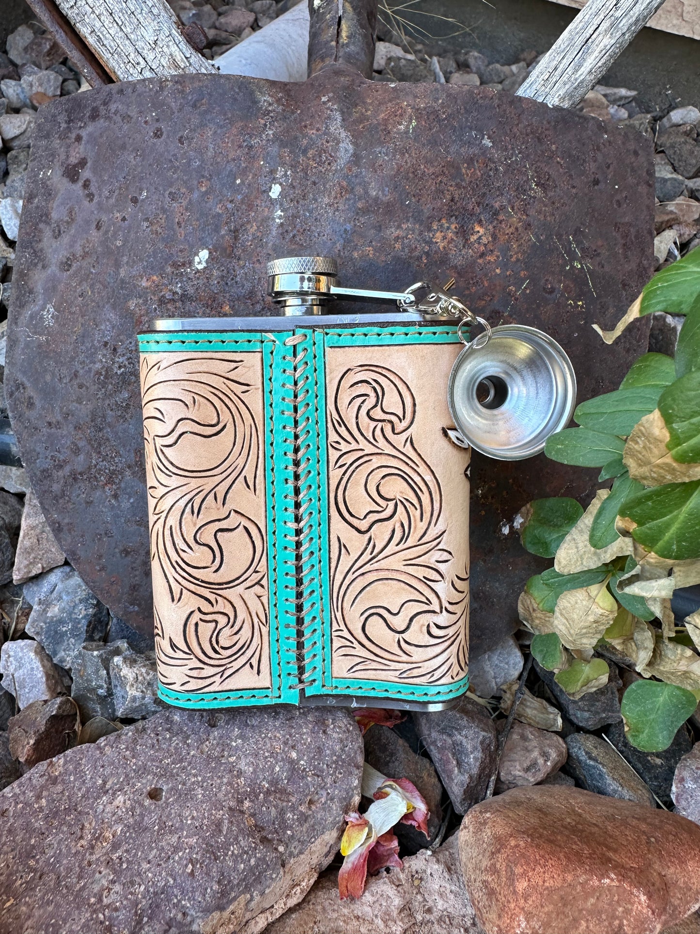 Western tooled leather floral and feather hat flask