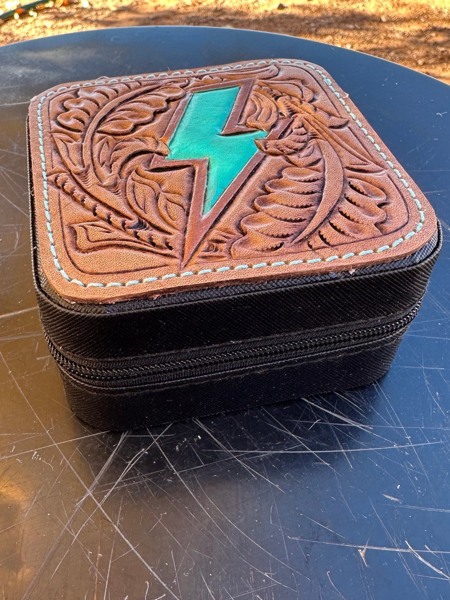 Western tooled leather lightning bolt patch jewelry case