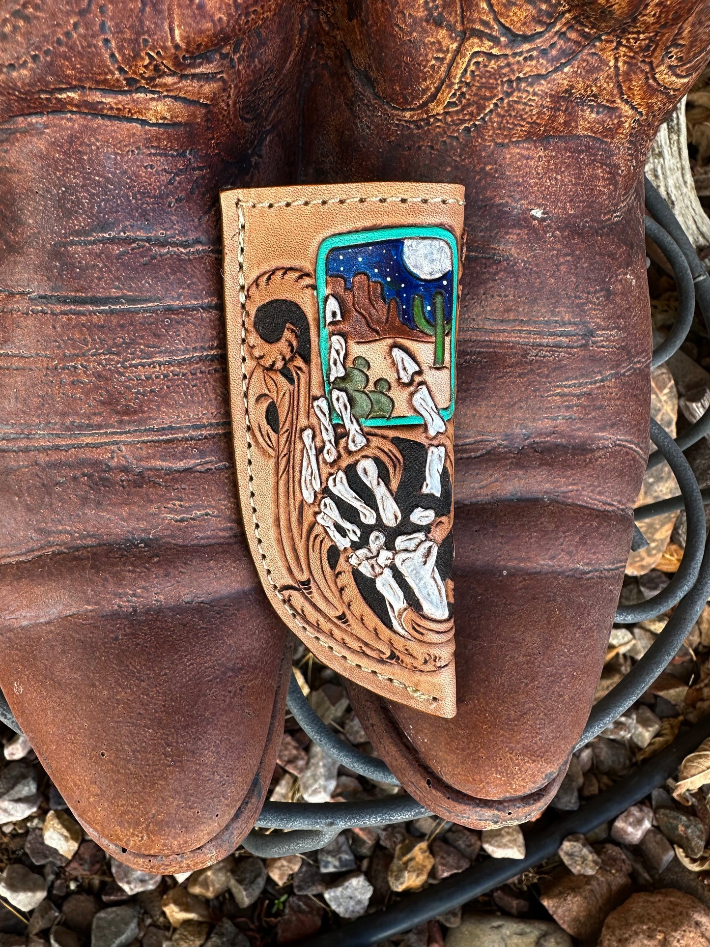 Western tooled leather skeleton hand and desert card knife sheath