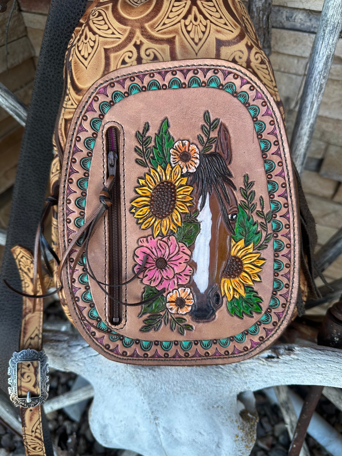 Western tooled leather floral horse sling bag