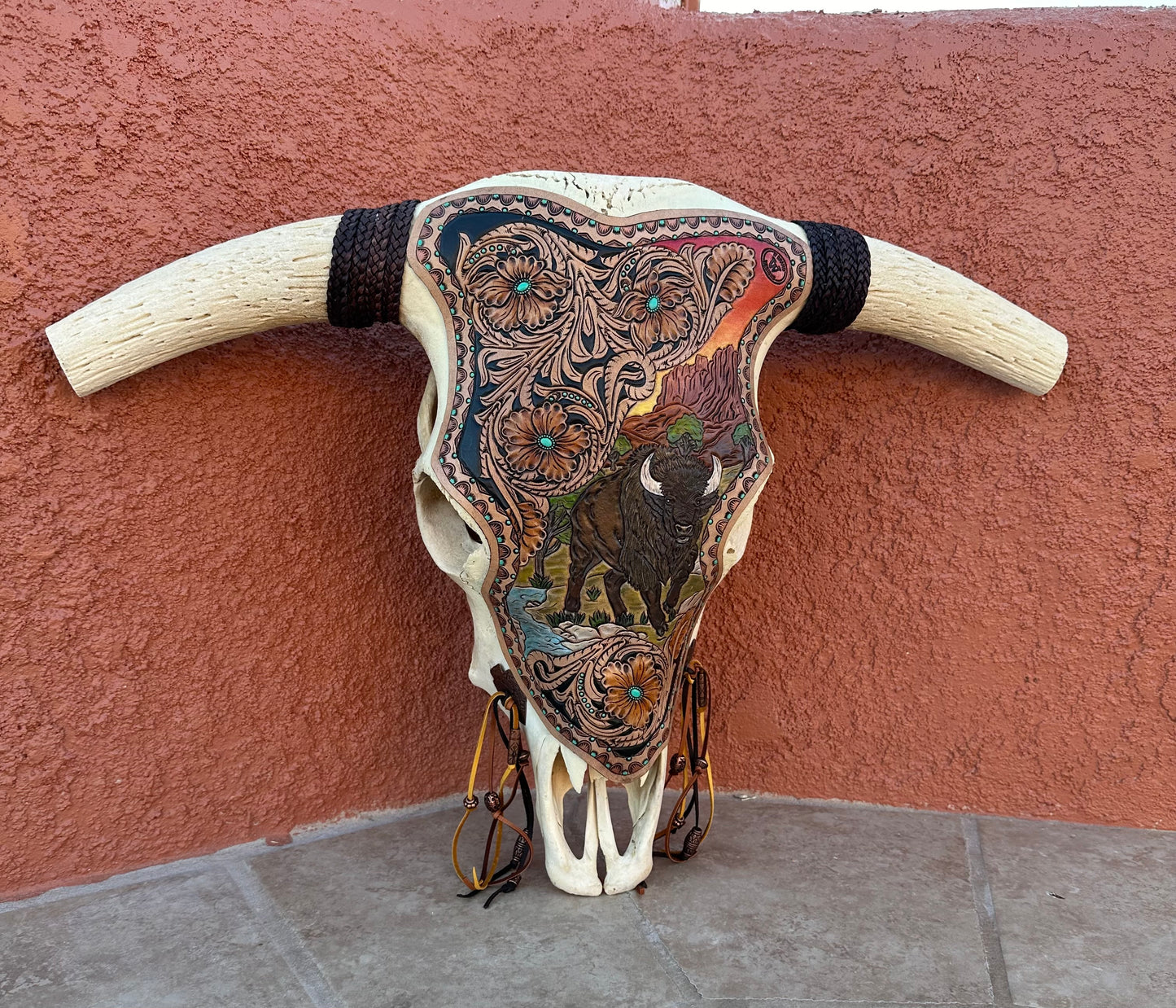 Western tooled leather bison and floral longhorn skull