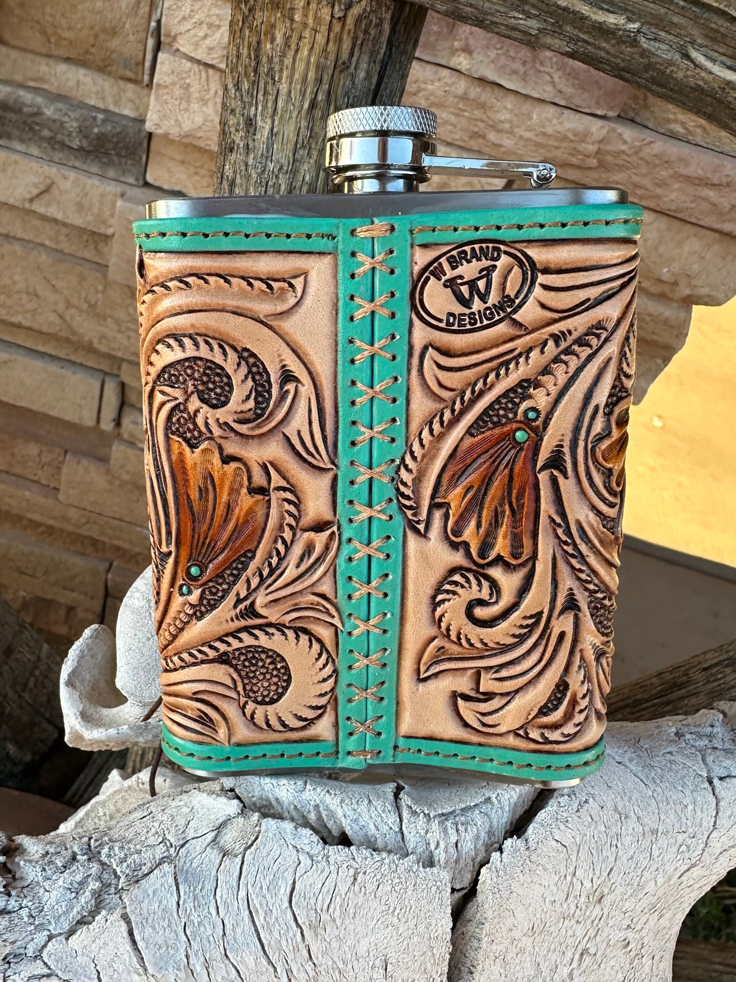 Western tooled leather floral horseshoe flask