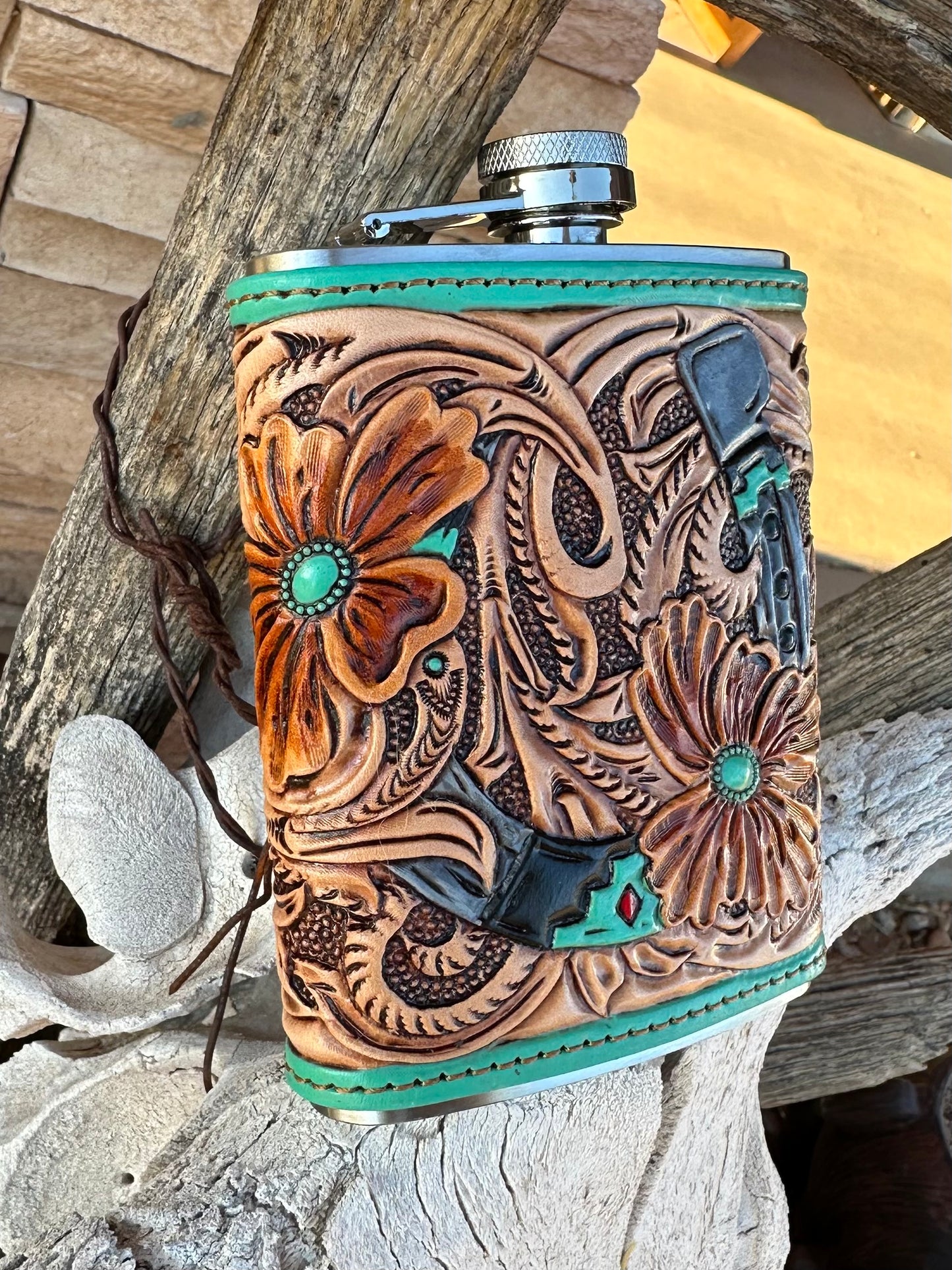 Western tooled leather floral horseshoe flask