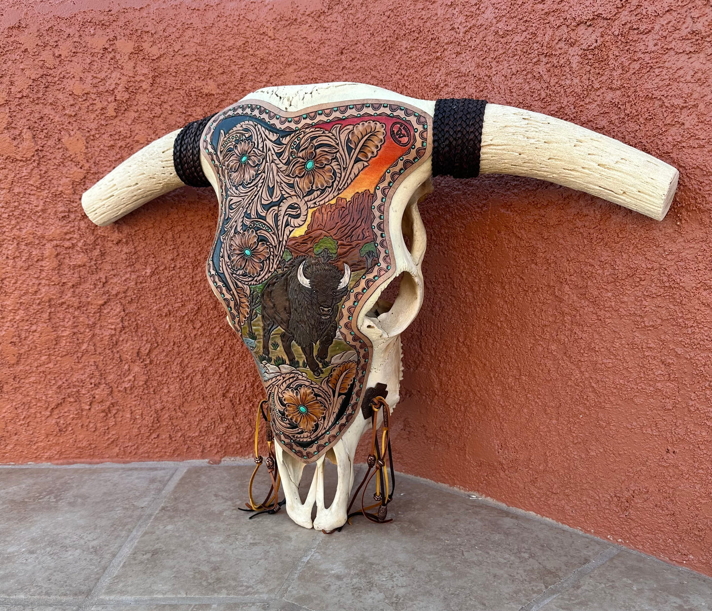 Western tooled leather bison and floral longhorn skull