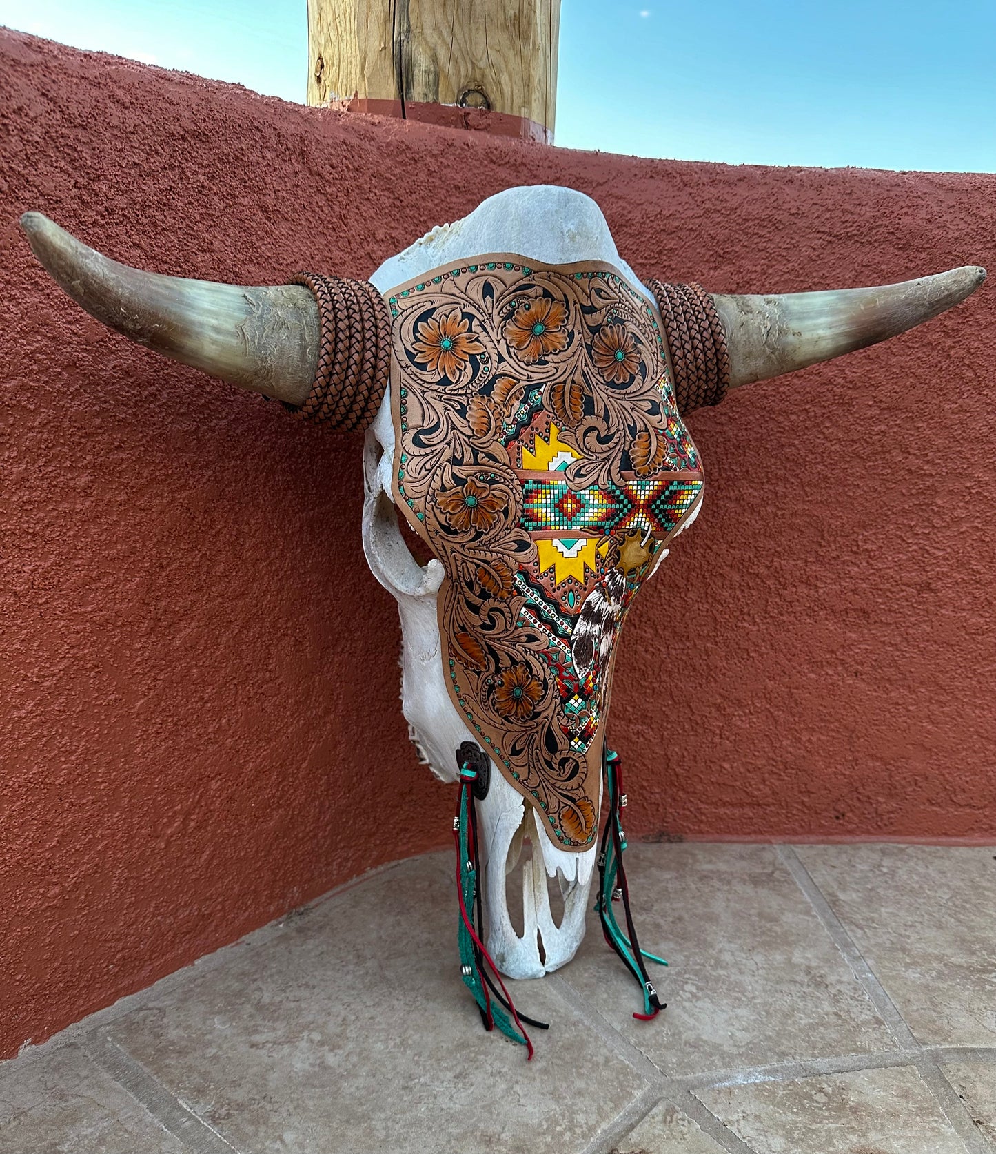 Western tooled floral and southwestern feather and faux beadwork cow skull