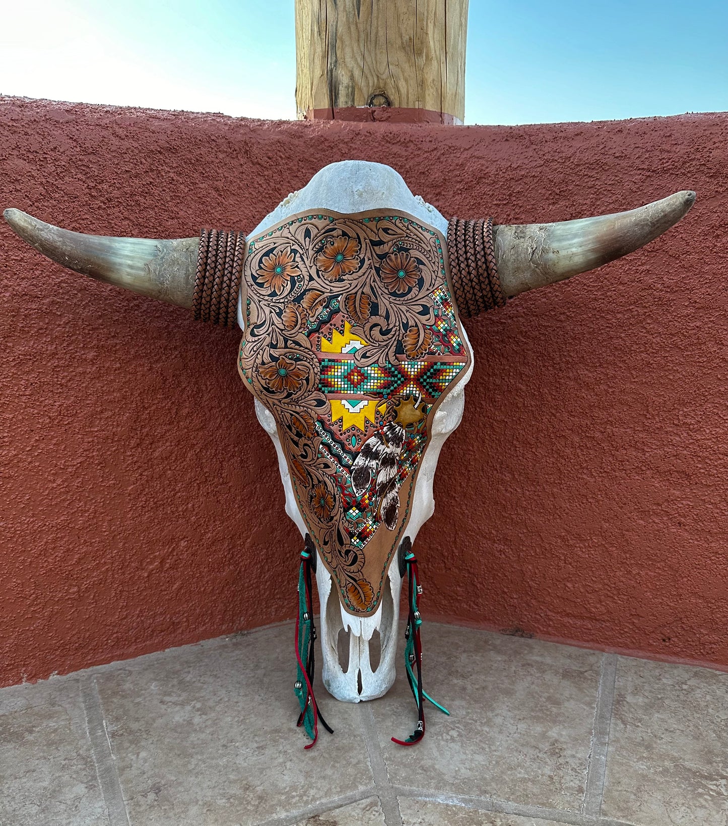 Western tooled floral and southwestern feather and faux beadwork cow skull