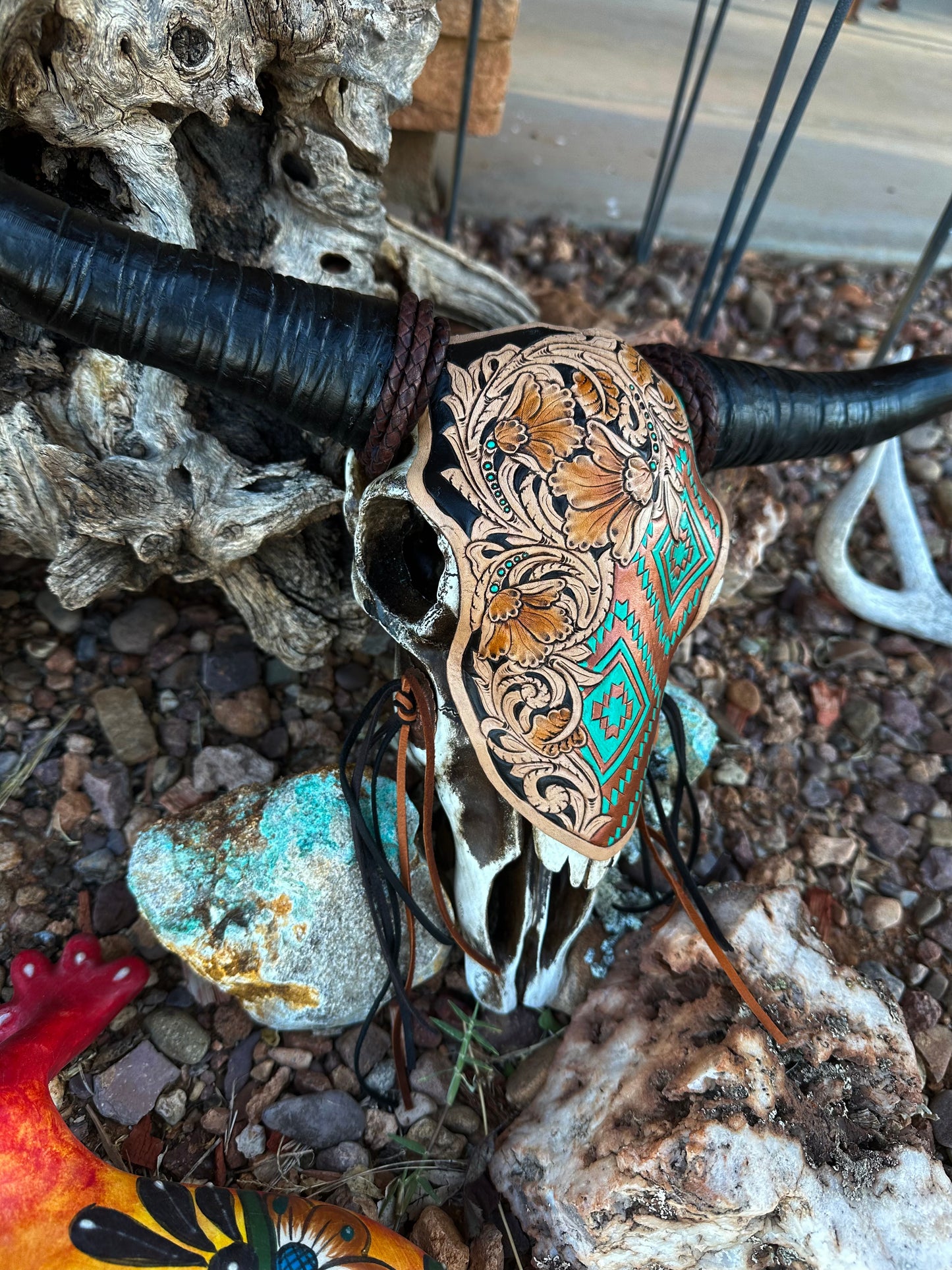 Western tooled leather floral and copper Aztec print resin cow skull