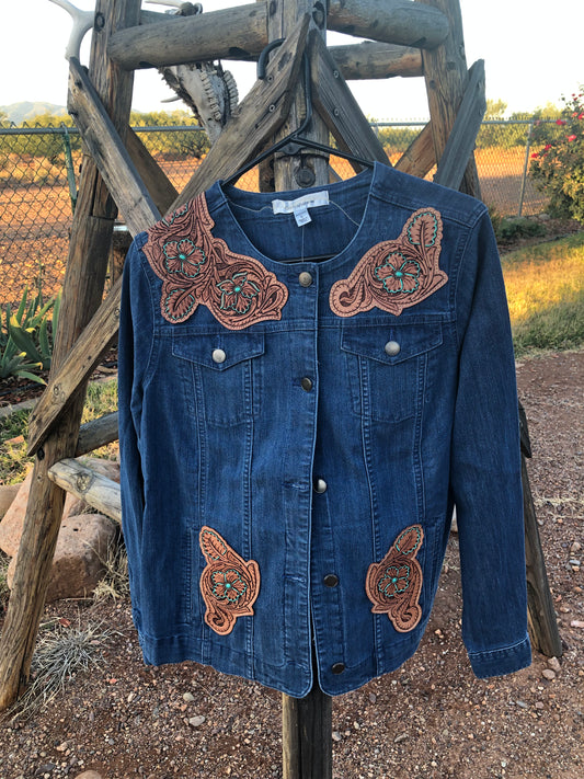 Women’s western tooled leather floral collarless denim jacket