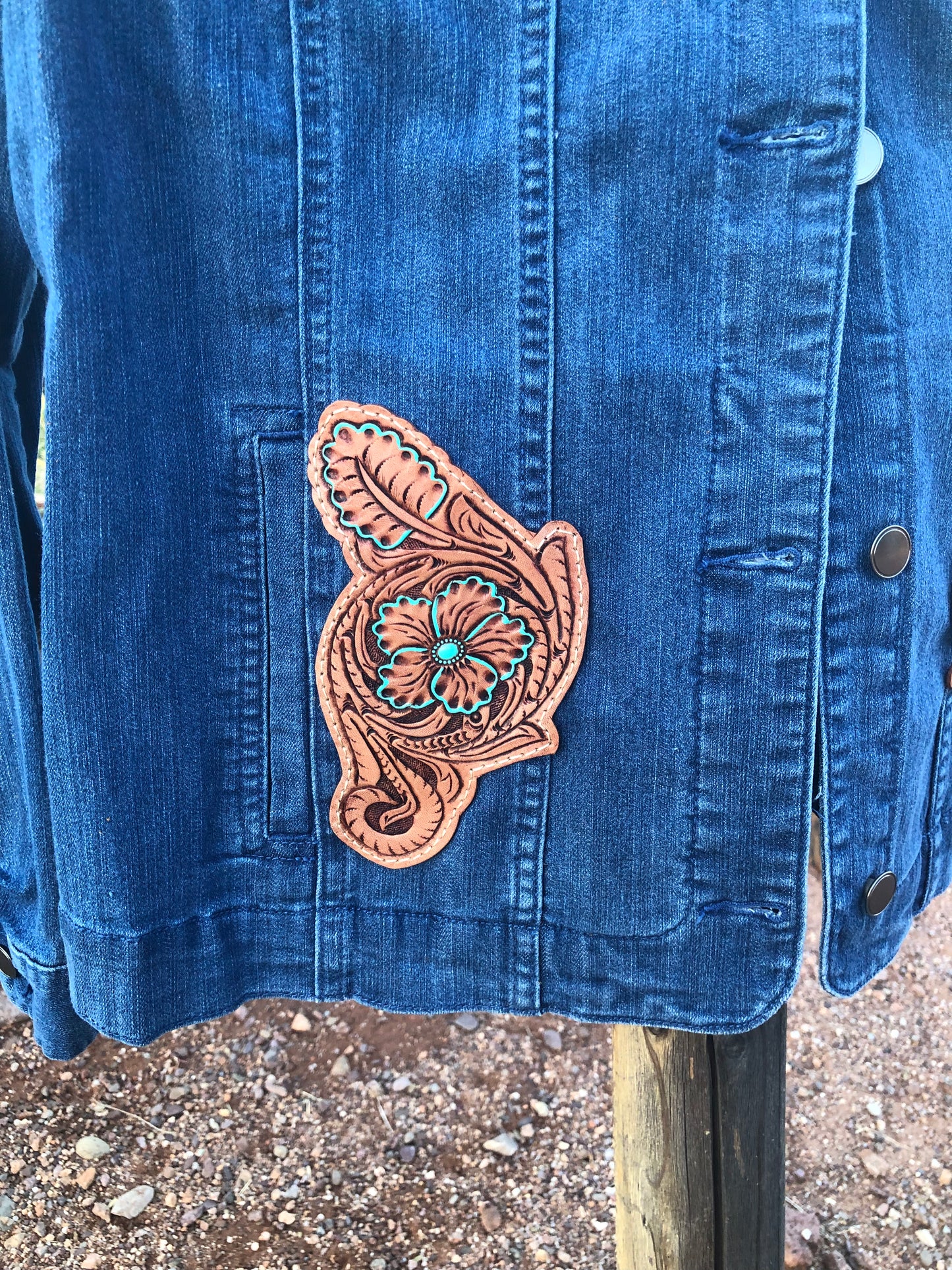 Women’s western tooled leather floral collarless denim jacket