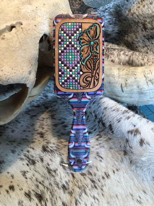 Western tooled leather floral with faux beadwork patch on serape and leopard print cow skull print paddle brush