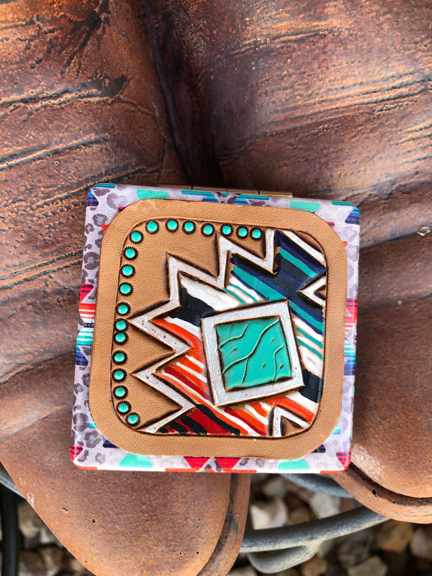 Southwestern tooled leather geometric patch on southwestern compact