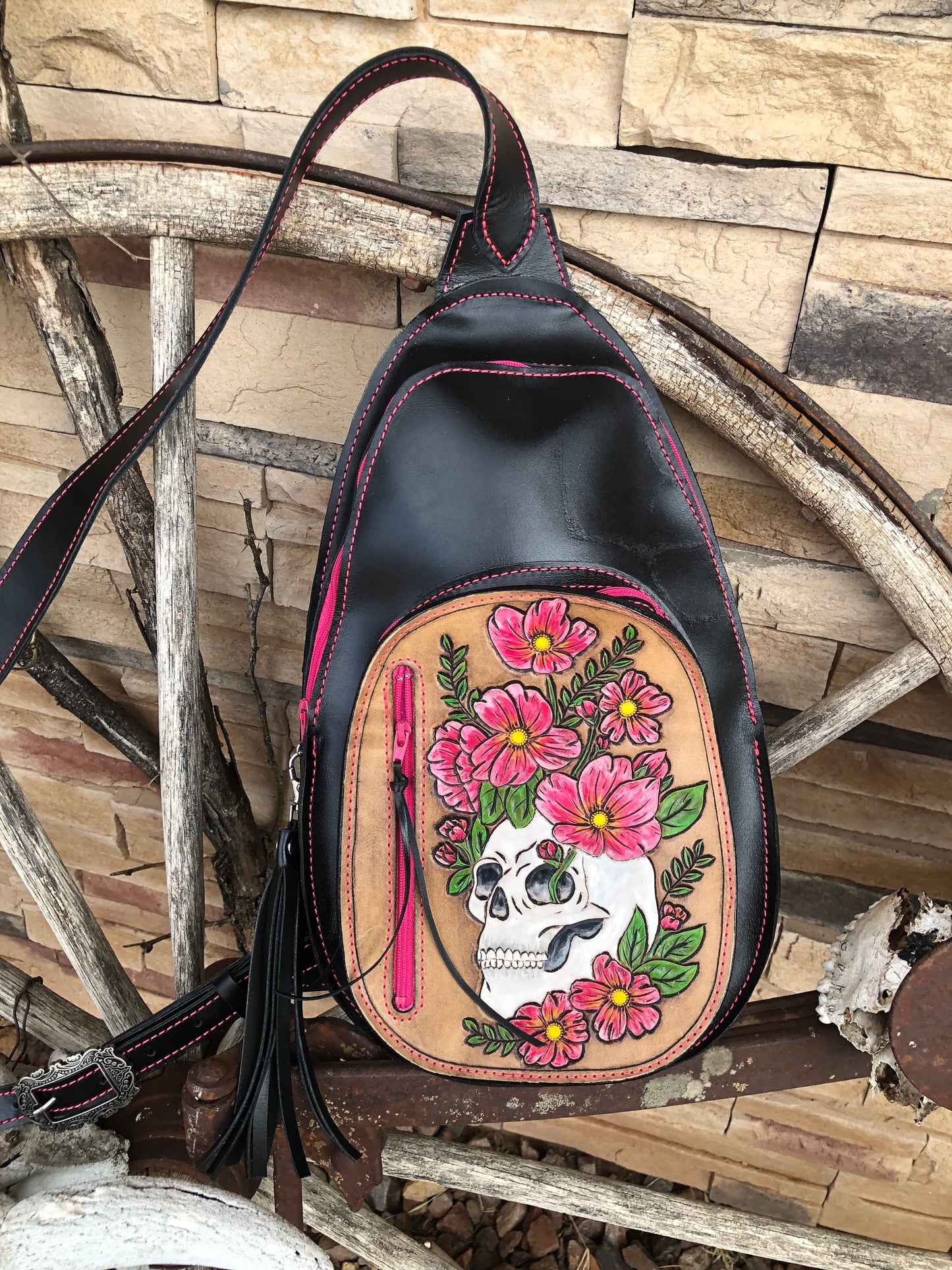 Tooled leather skull and flower sling bag