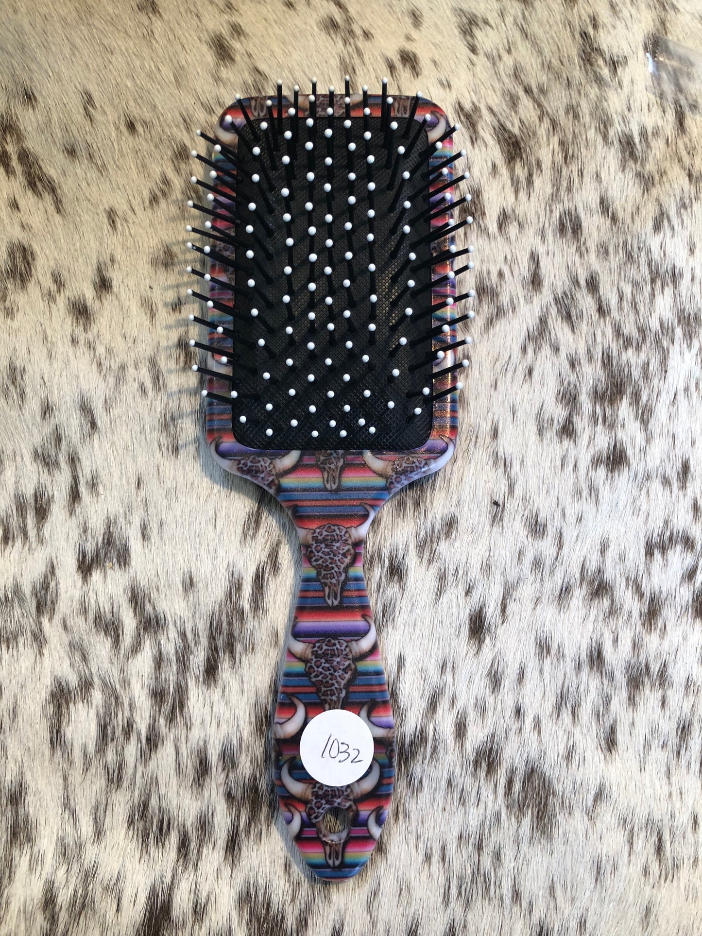 Western tooled leather floral with faux beadwork patch on serape and leopard print cow skull print paddle brush