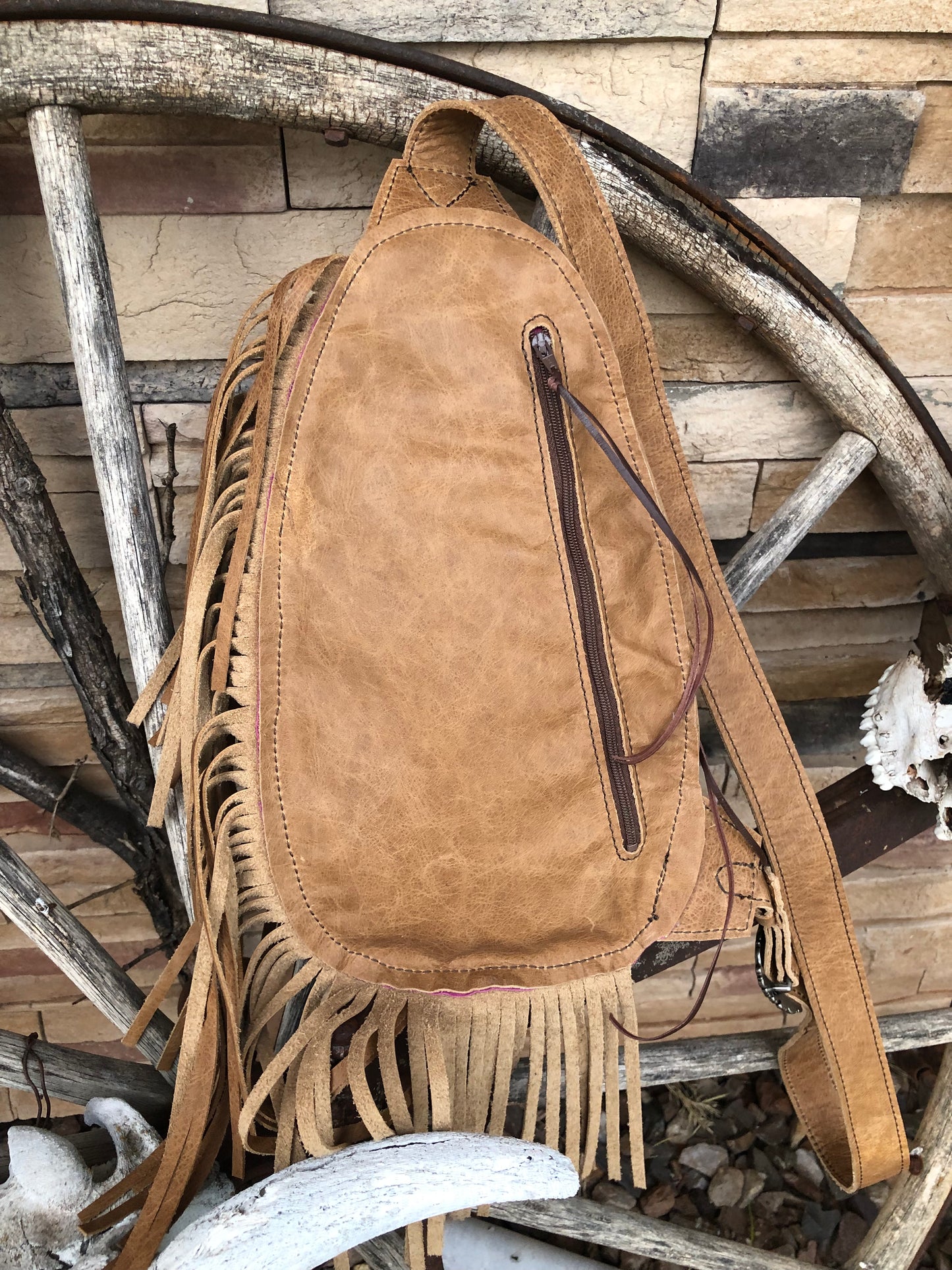 Small Southwestern tooled leather floral fringe sling bag