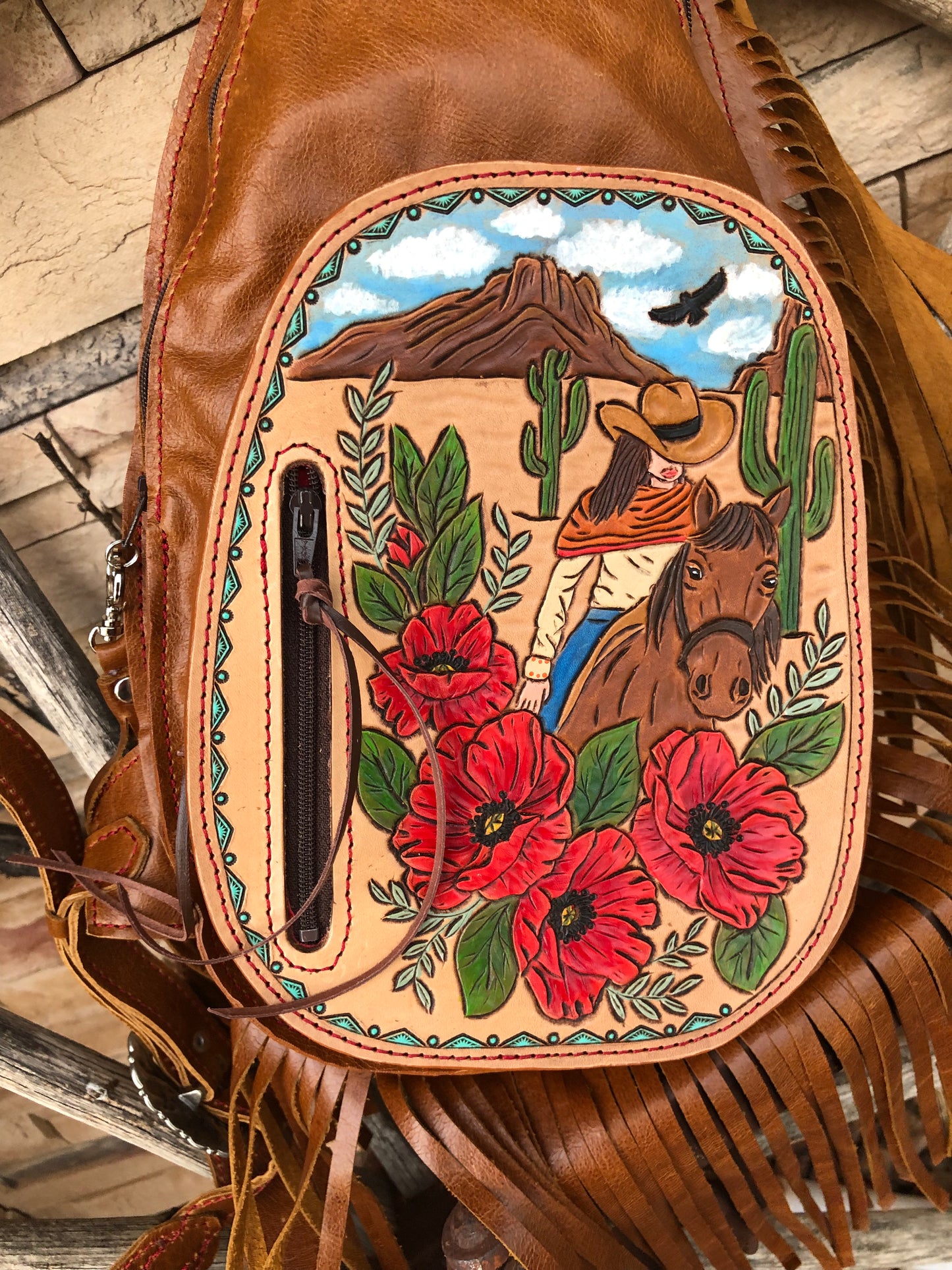 Western tooled leather desert cowgirl with poppies fringe sling bag