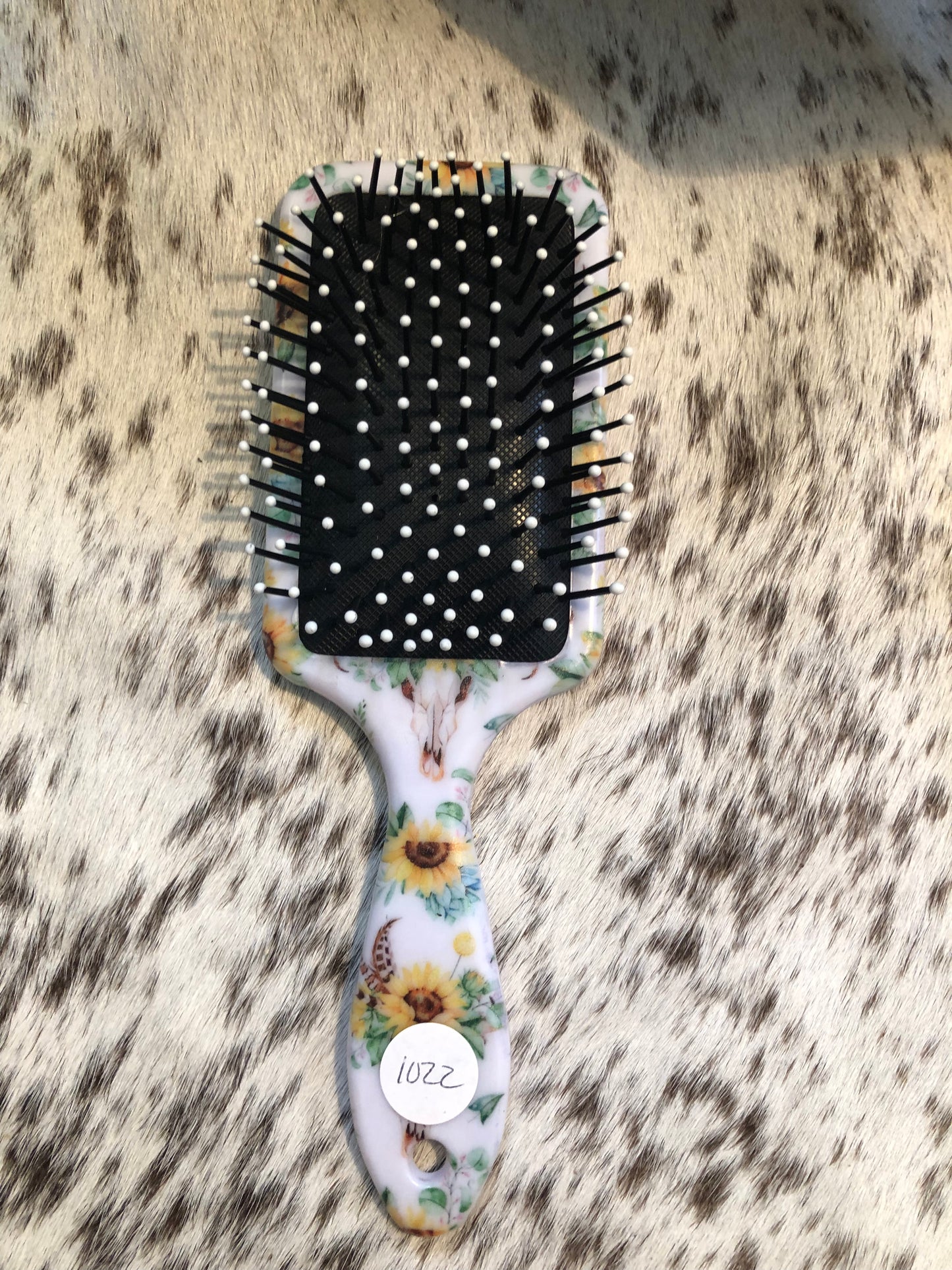 Western tooled leather sunflower patch on sunflower cow skull print paddle brush