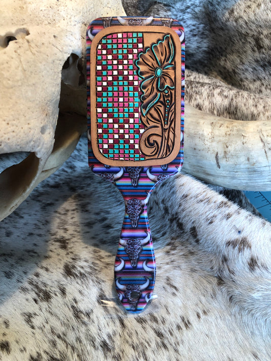 Western tooled leather floral and faux beadwork patch on serape and leopard print cow skull print paddle brush