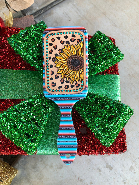 Western tooled leather sunflower and leopard print patch on serape and leopard print paddle brush