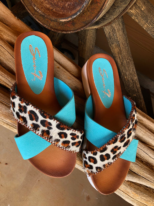 Women’s size 7 turquoise and leopard print hair on hide sandals