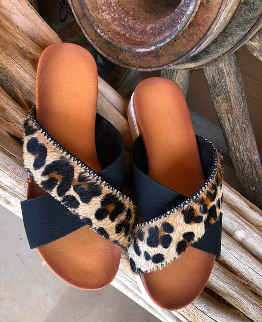 Women’s size 7 black and leopard print hair on hide sandals