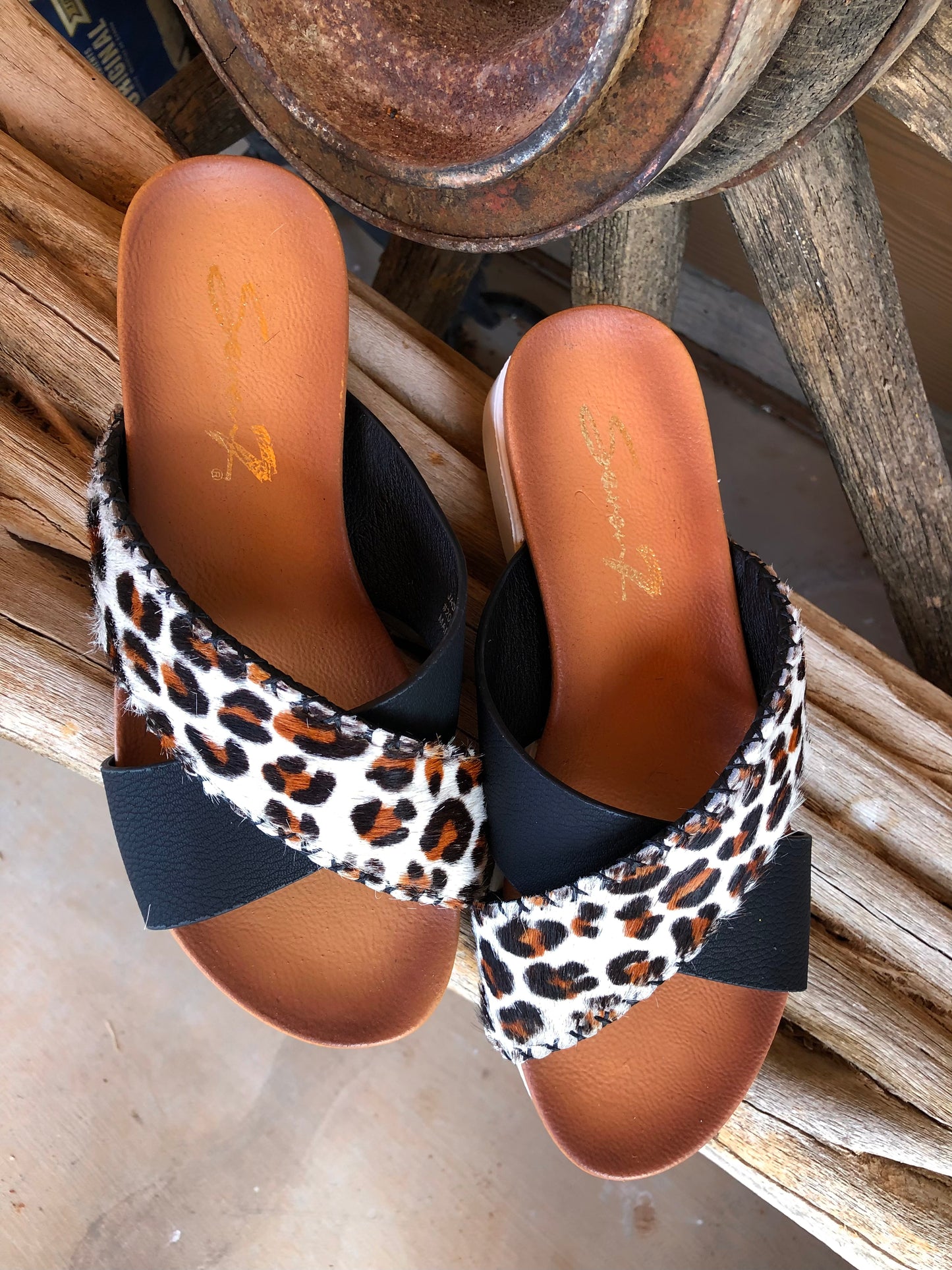 Women’s size 7 black and leopard print hair on hide sandals