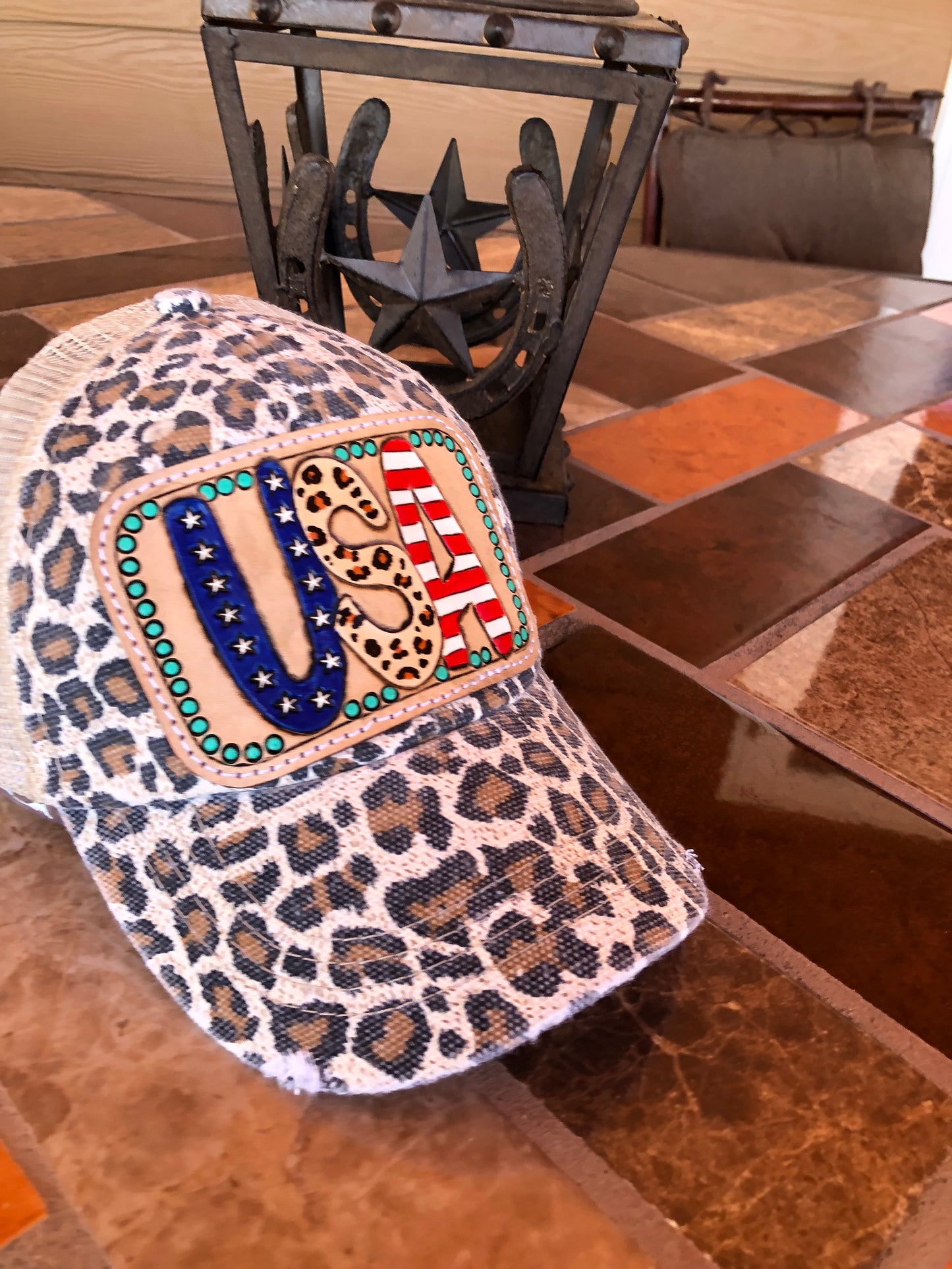 Women’s tooled leather patriotic USA patch leopard print trucker cap